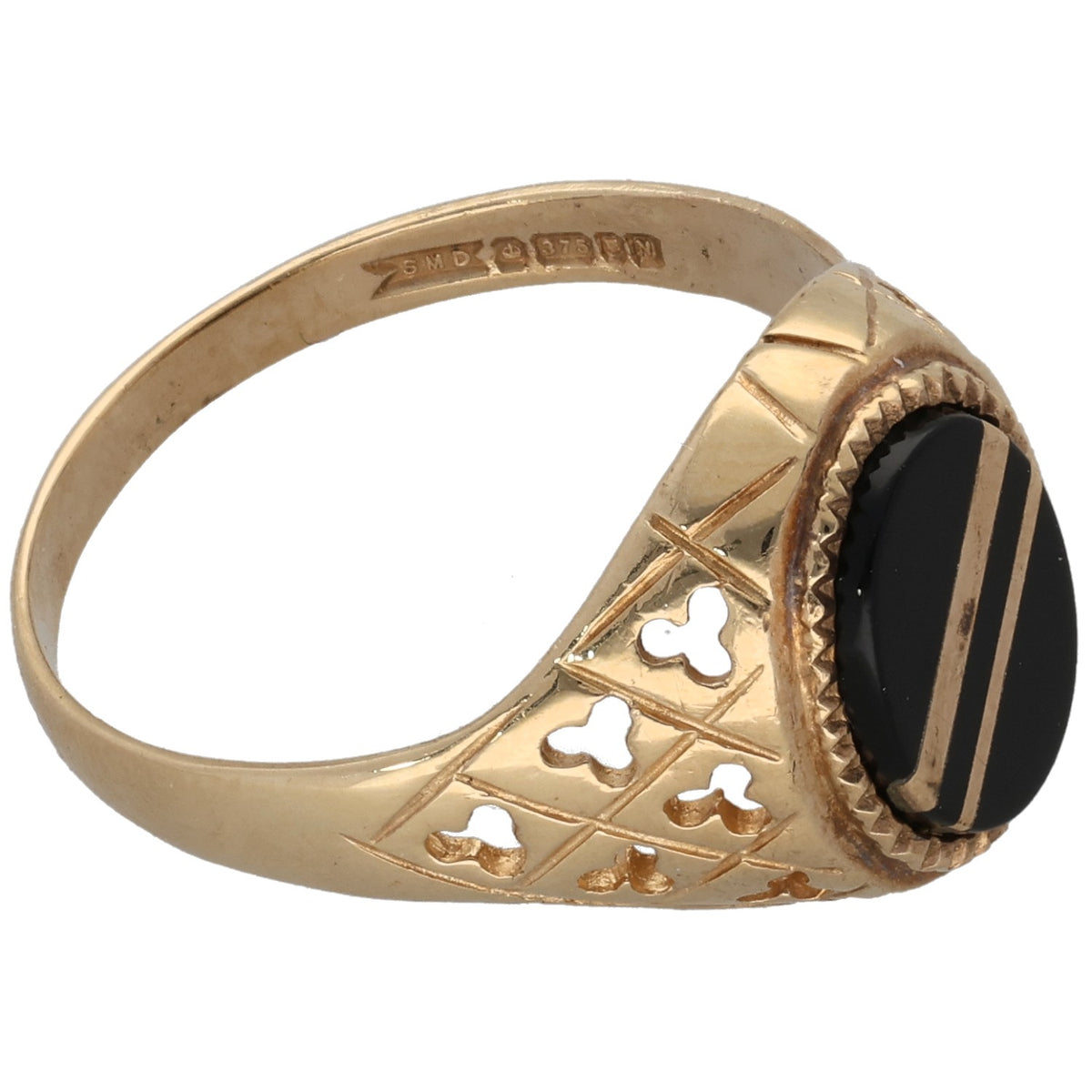 Gold onyx ring with oval black stone in bezel and cutout quatrefoil style detailing