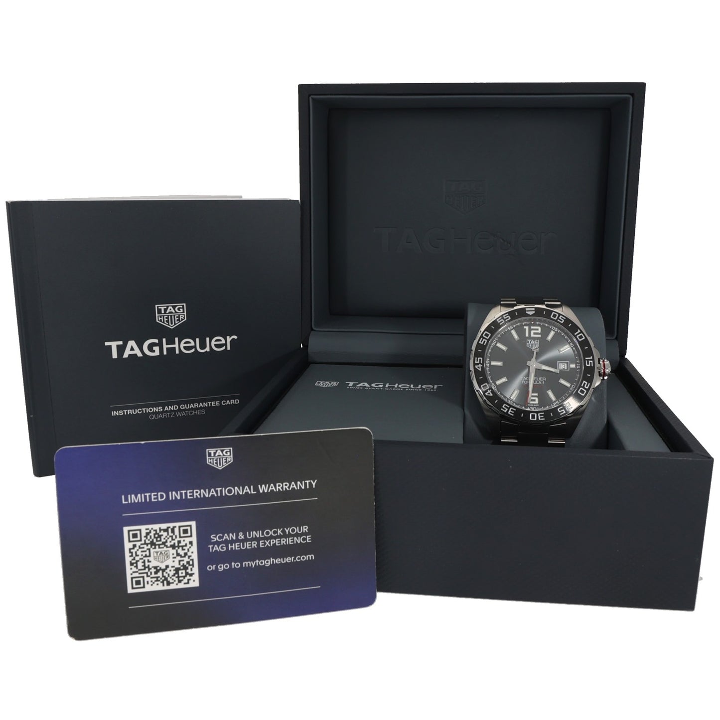 Tag Heuer F1 WAZ2011 watch in packaging with warranty card and instruction booklet