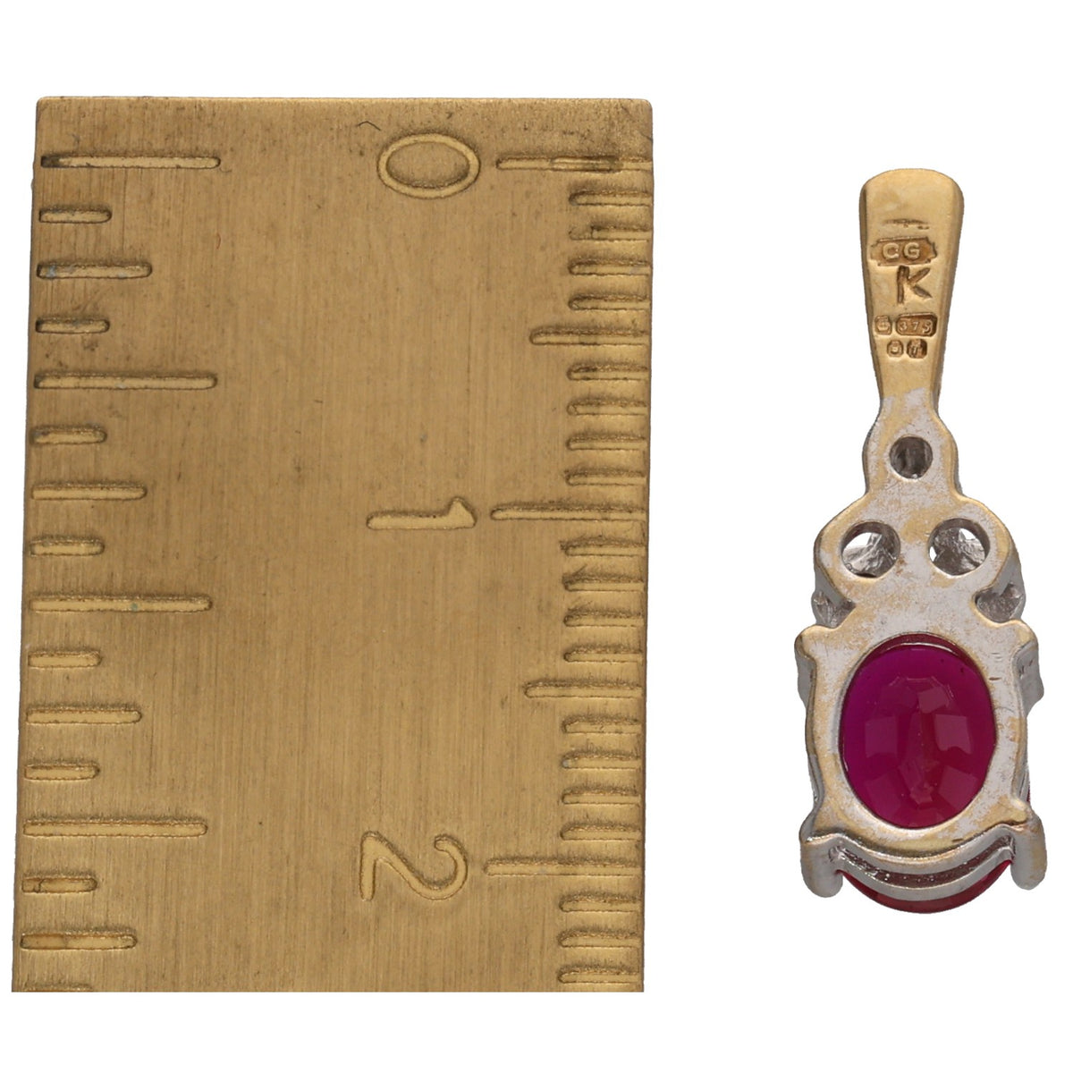 Gold-toned ruby pendant bail with small round diamond cluster around oval stone
