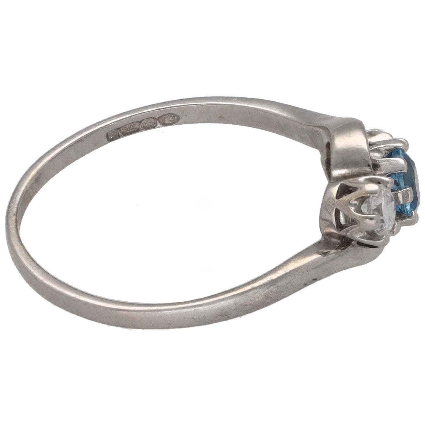 Three-stone white gold ring with blue topaz and clear CZ accents, side view