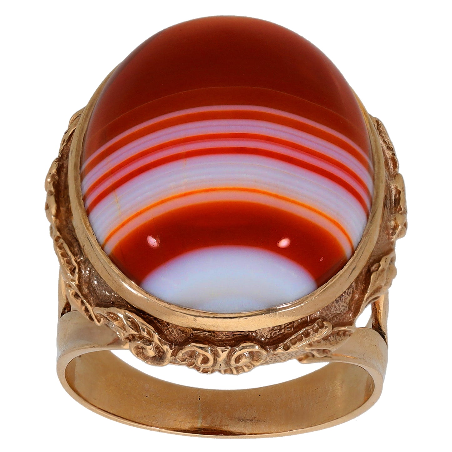 Red agate cabochon cocktail ring with white banding and detailed gold frame