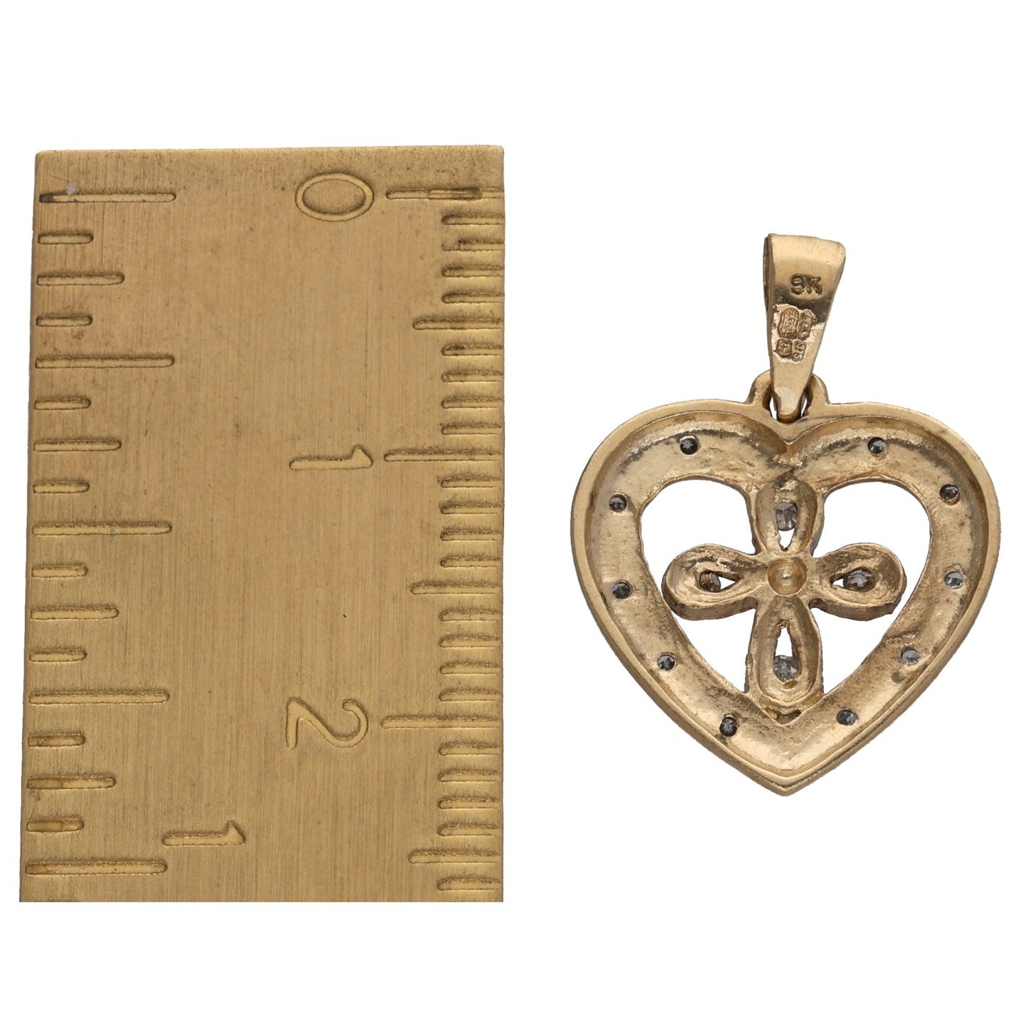 Gold heart pendant with bail; stamped marking on top and diamond accents on edge