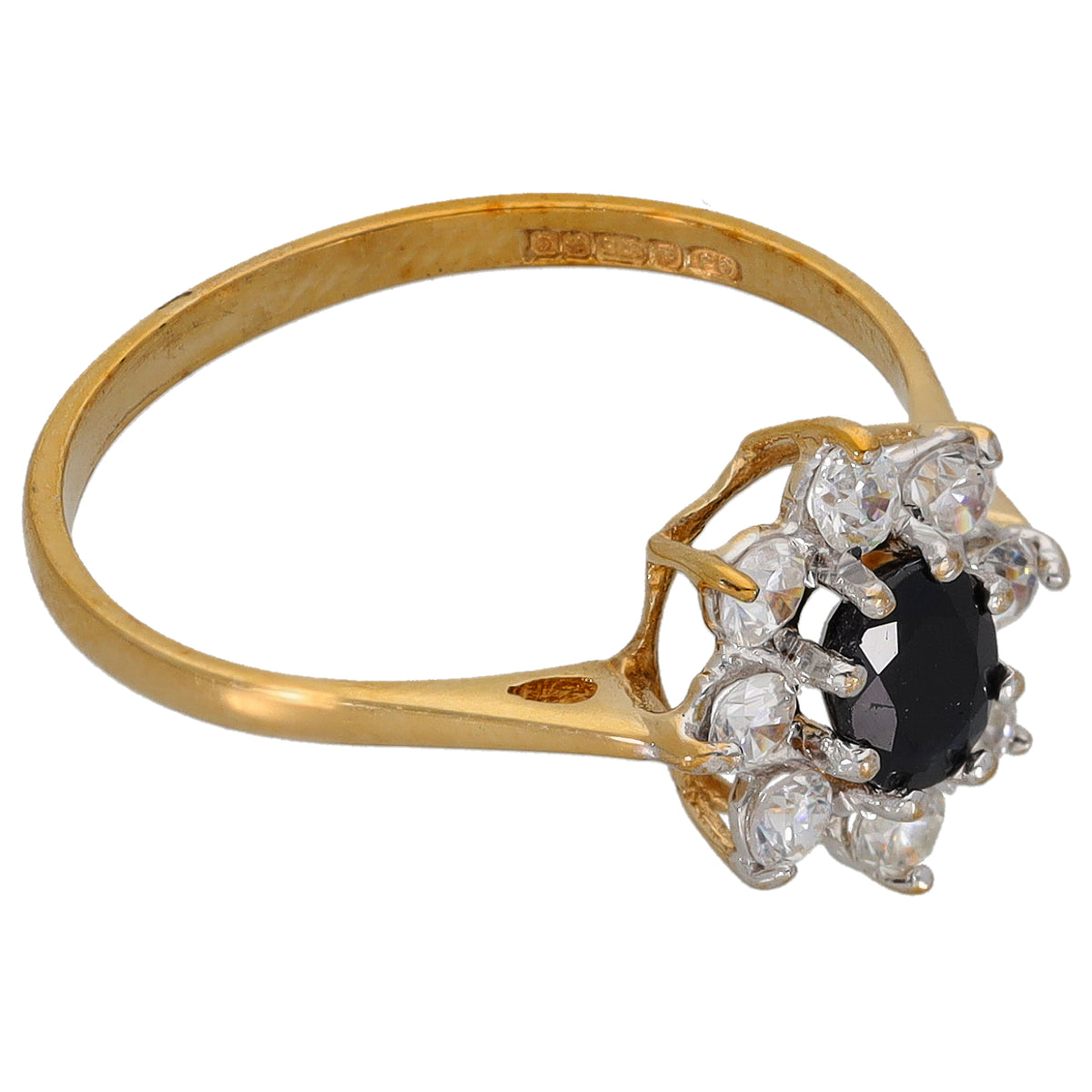 Gold ring with black center stone and clear cubic zirconia cluster, side angle view