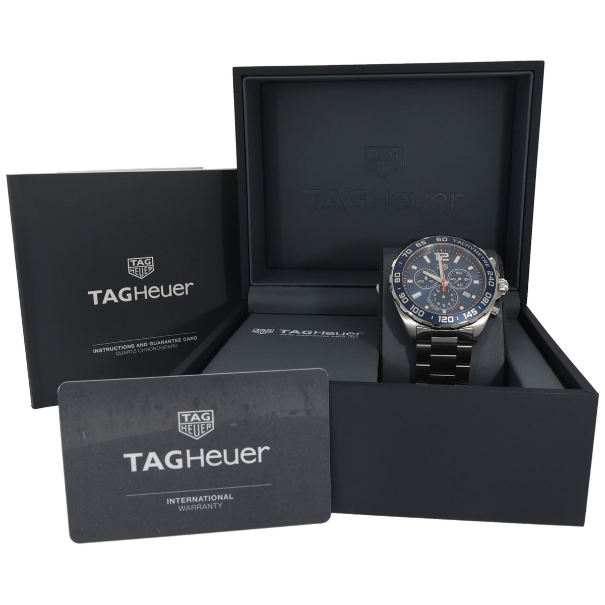 Tag Heuer F1 CAZ1014 watch in open presentation box with warranty card and black inserts