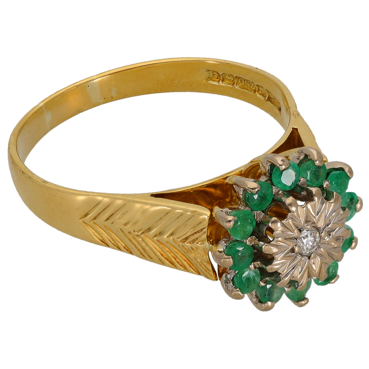 Gold ring with engraved band and emerald cluster with round diamond