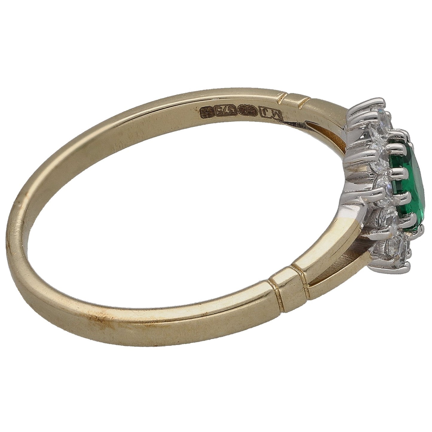 Gold-tone imitation ring side view with green center stone and clear prong accents, Size N