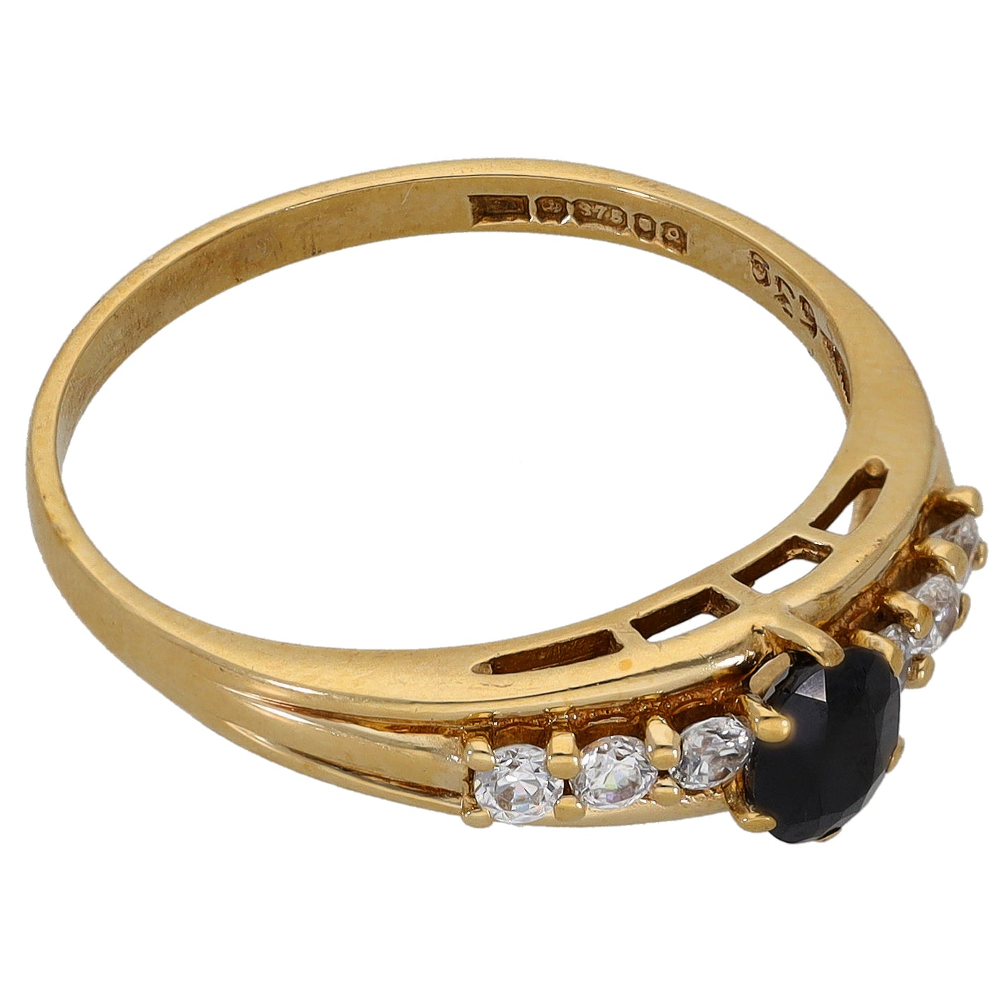 Gold-tone ring with oval black center stone and clear round accents