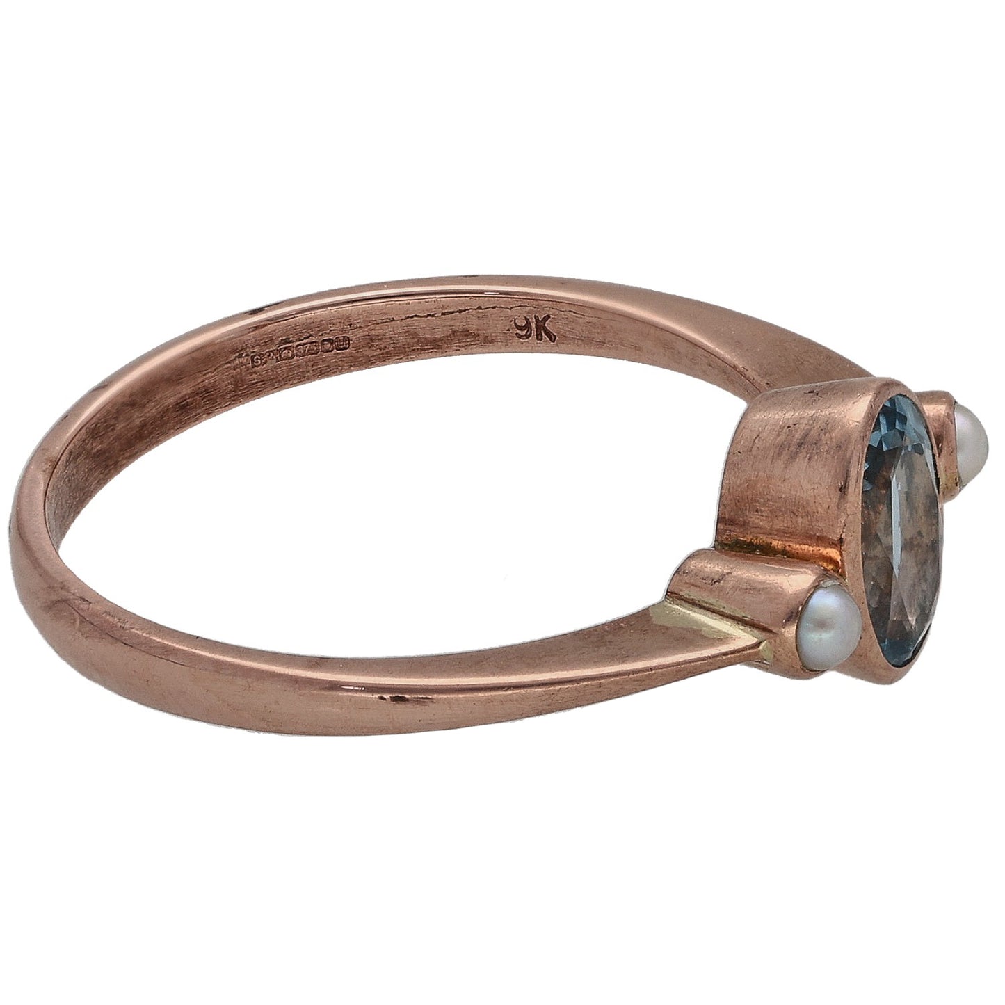 Rose gold ring side view with oval aquamarine, cultured pearl, and 9K hallmark