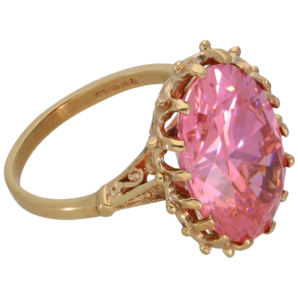 Gold-tone ring with large pink oval CZ solitaire and scalloped prong setting