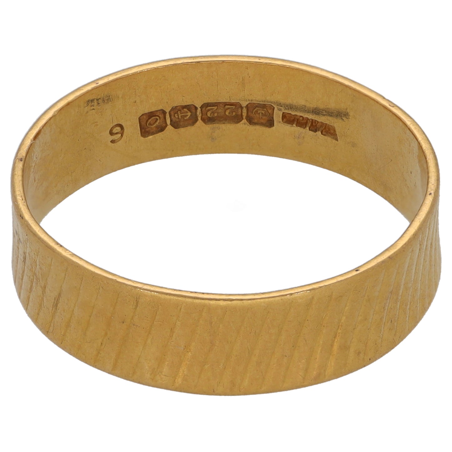 Gold wedding ring, wide textured band with engraved interior markings