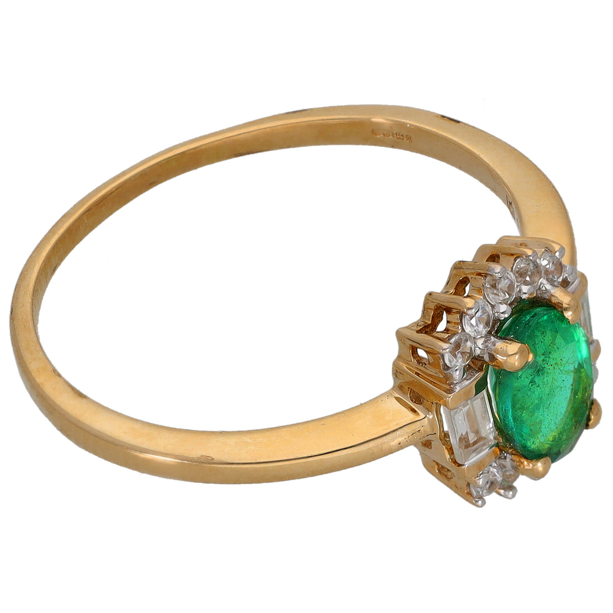 Gold cocktail ring angled view: green oval gemstone with clear baguette and round accents