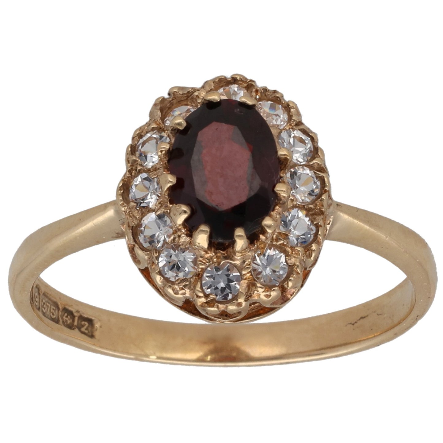 Gold-tone cocktail ring with oval dark red gem and clear stone halo