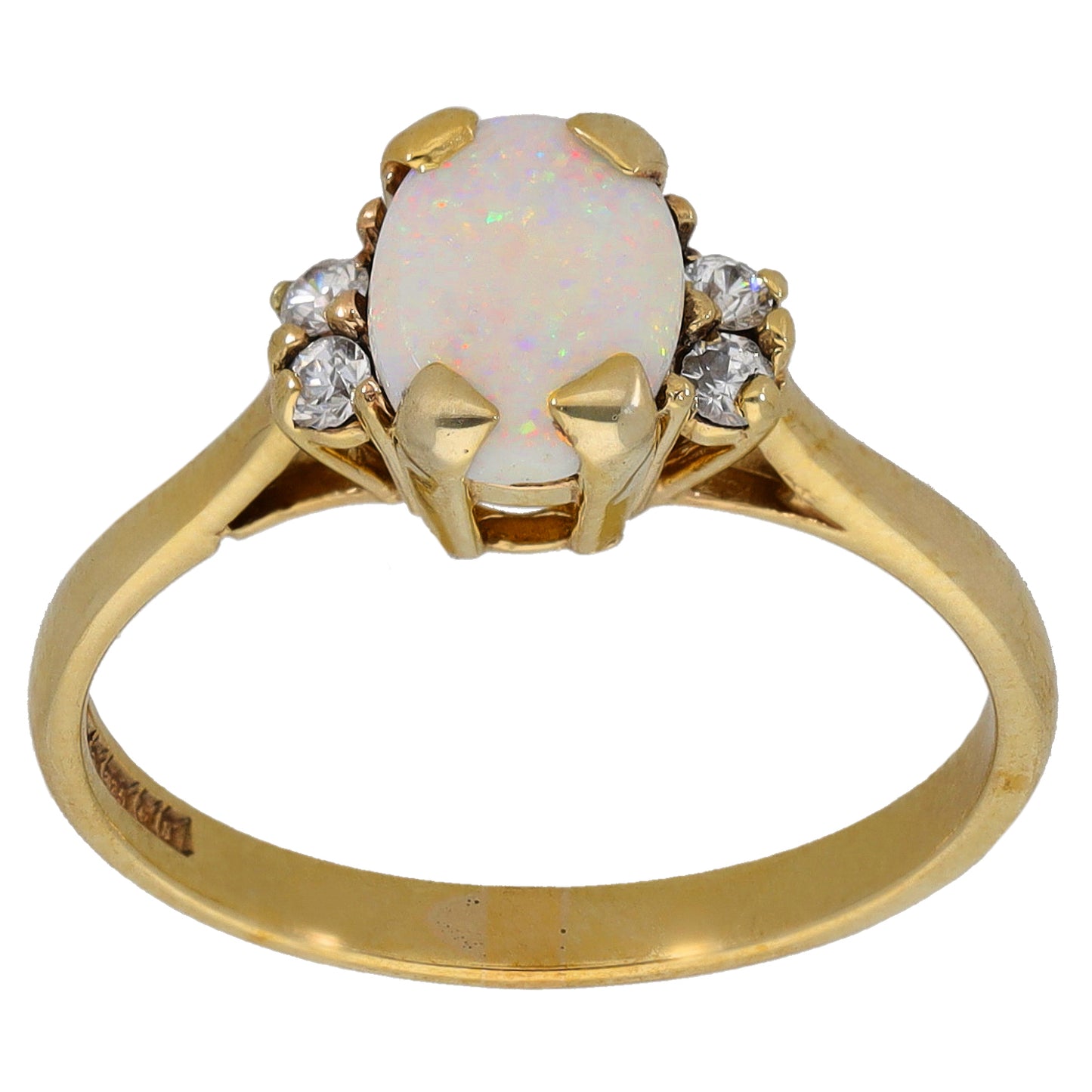 Gold ring with opal-like center stone and four clear accent stones