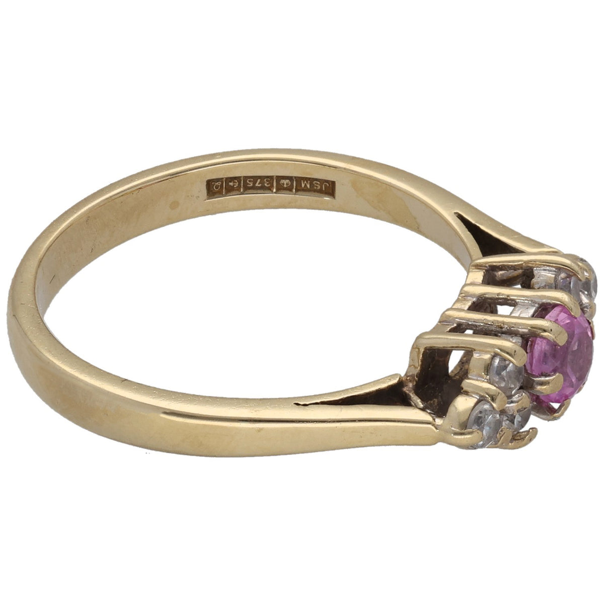 Gold cocktail ring with oval pink stone and clear prong-set accents, side view