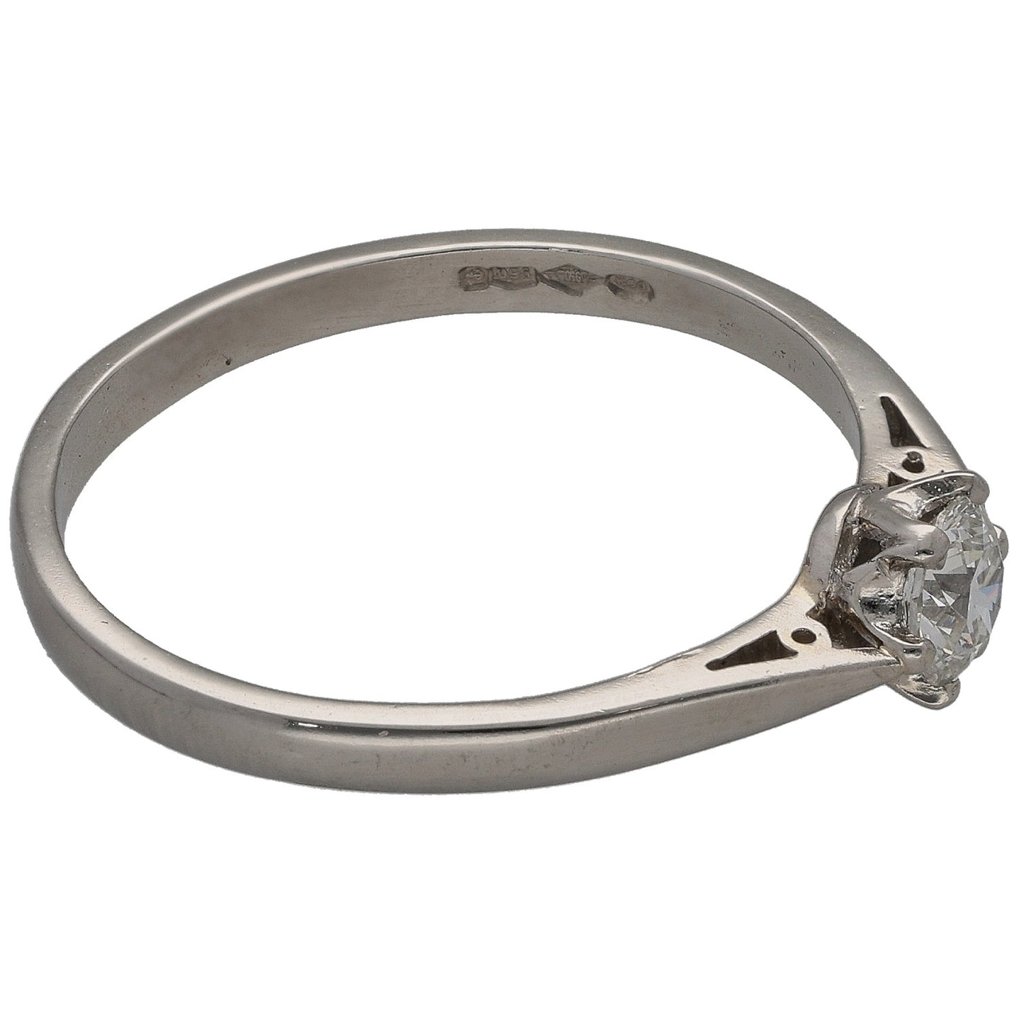 Platinum solitaire diamond ring with round center stone in four-prong side view