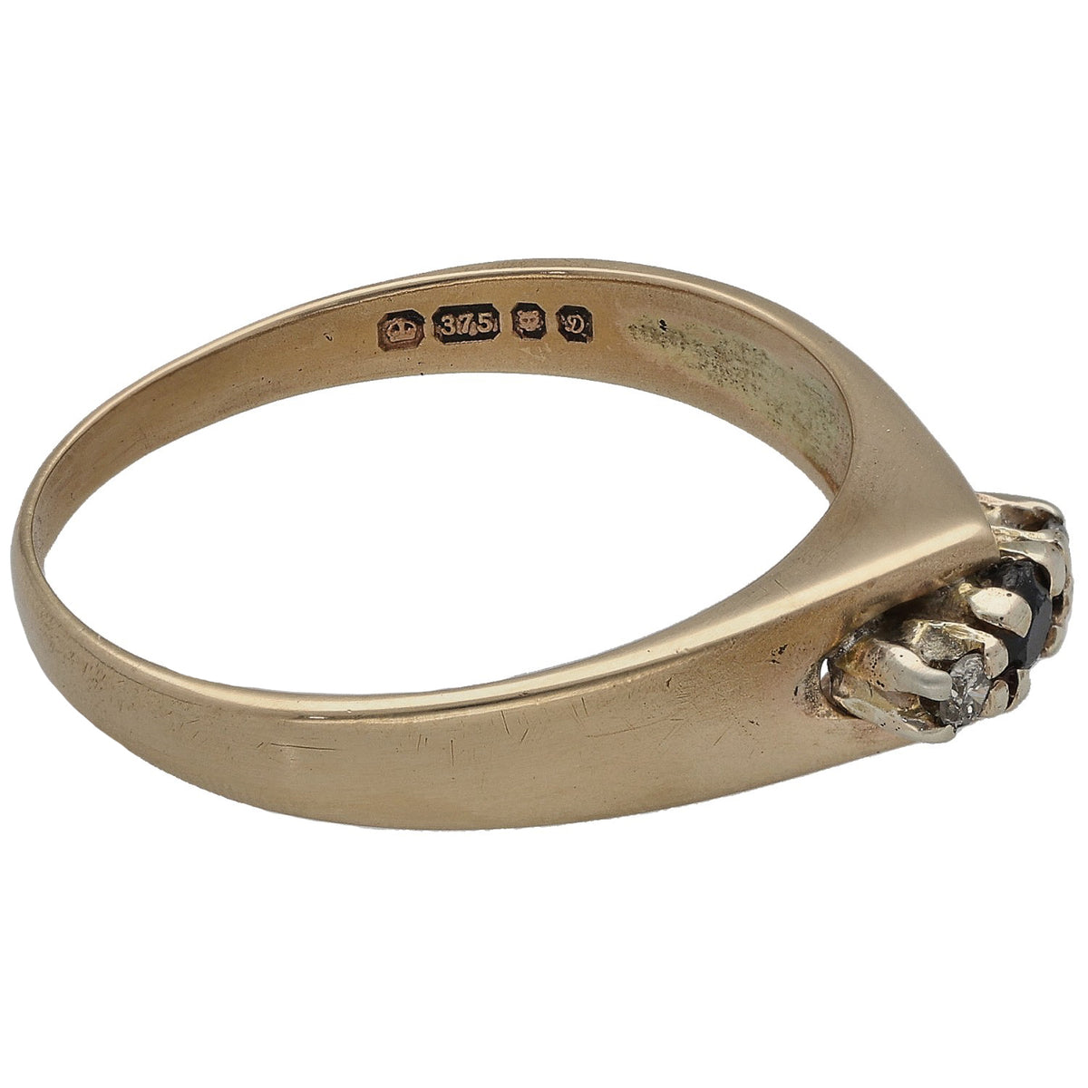 9ct gold ring with side profile of dark center stone; inner hallmark stamp