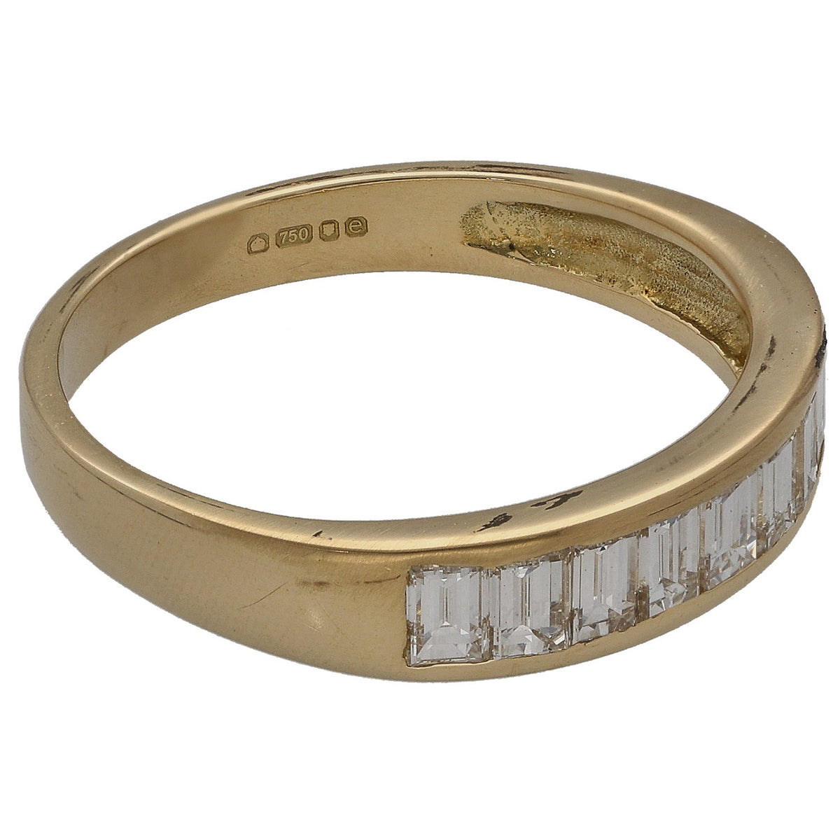 Gold ring side view with baguette diamond half-eternity row and inside hallmarks