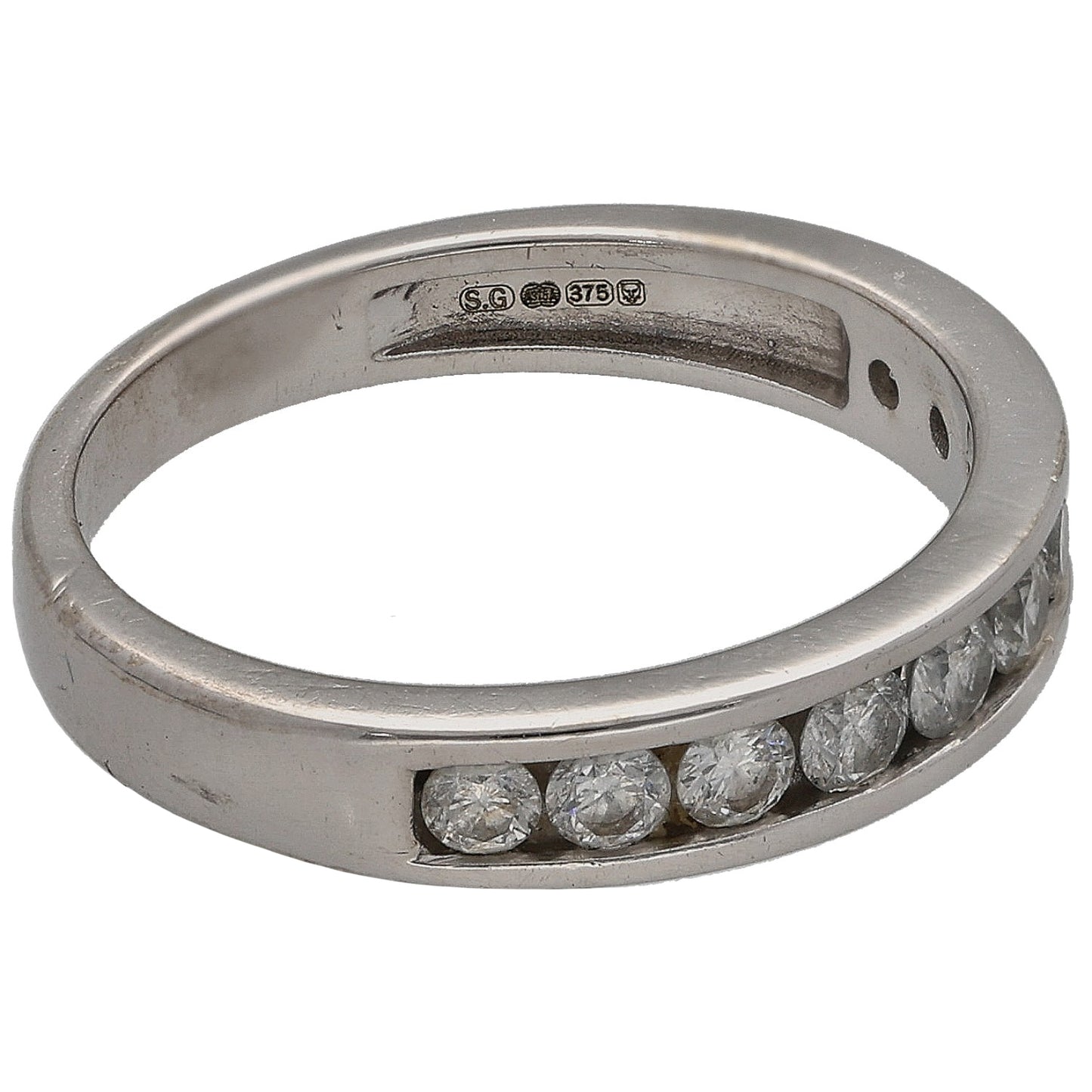 9ct white gold half eternity ring with round diamonds; hallmarks inside, size K