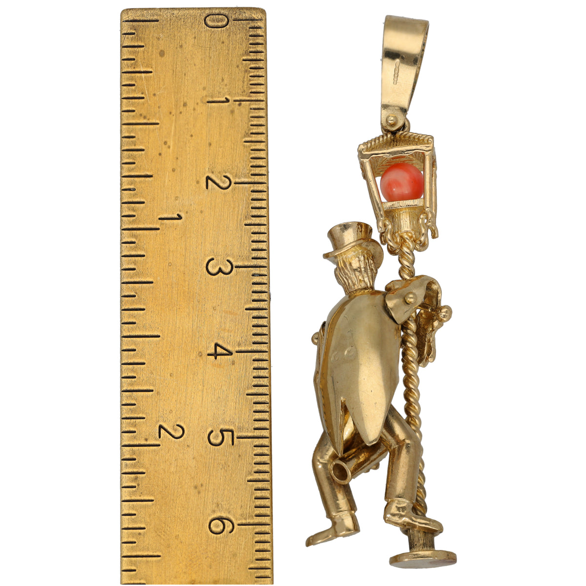 Gold character pendant with red coral center and CZ details, clown/doll figure
