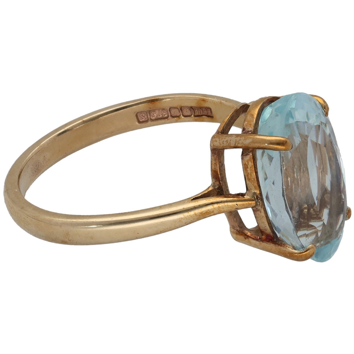 Gold aquamarine single-stone ring, side view with oval stone in setting