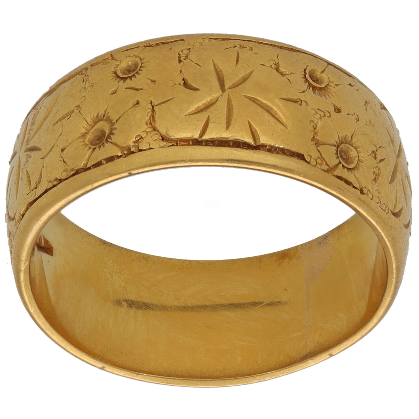 22ct gold patterned wedding ring with raised floral and starburst engravings