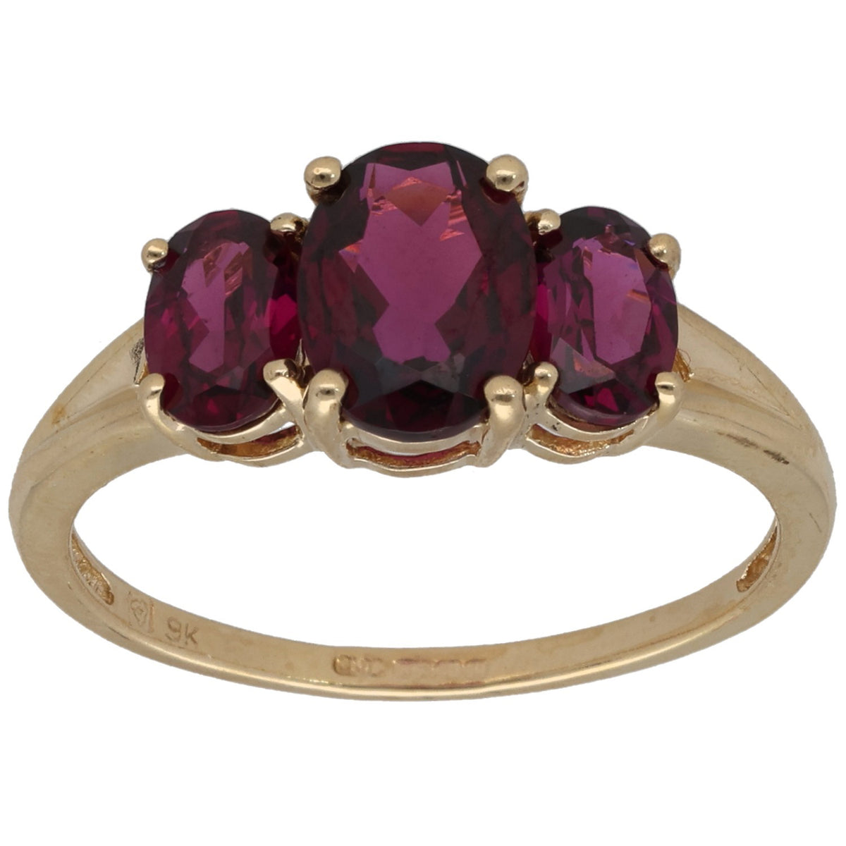 Gold three-stone garnet ring with oval center and two marquise stones, prong-set