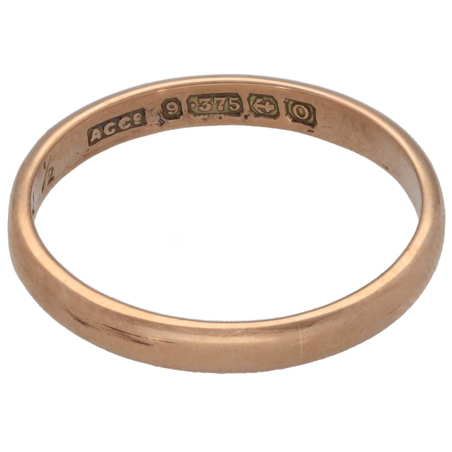 Plain rose gold wedding ring showing engraved outer hallmarks and maker marks