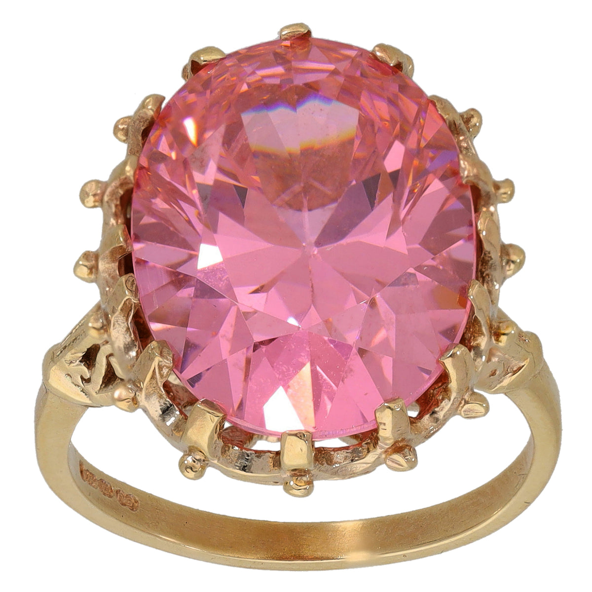Gold-tone ring with large pink round CZ solitaire and decorative prong setting