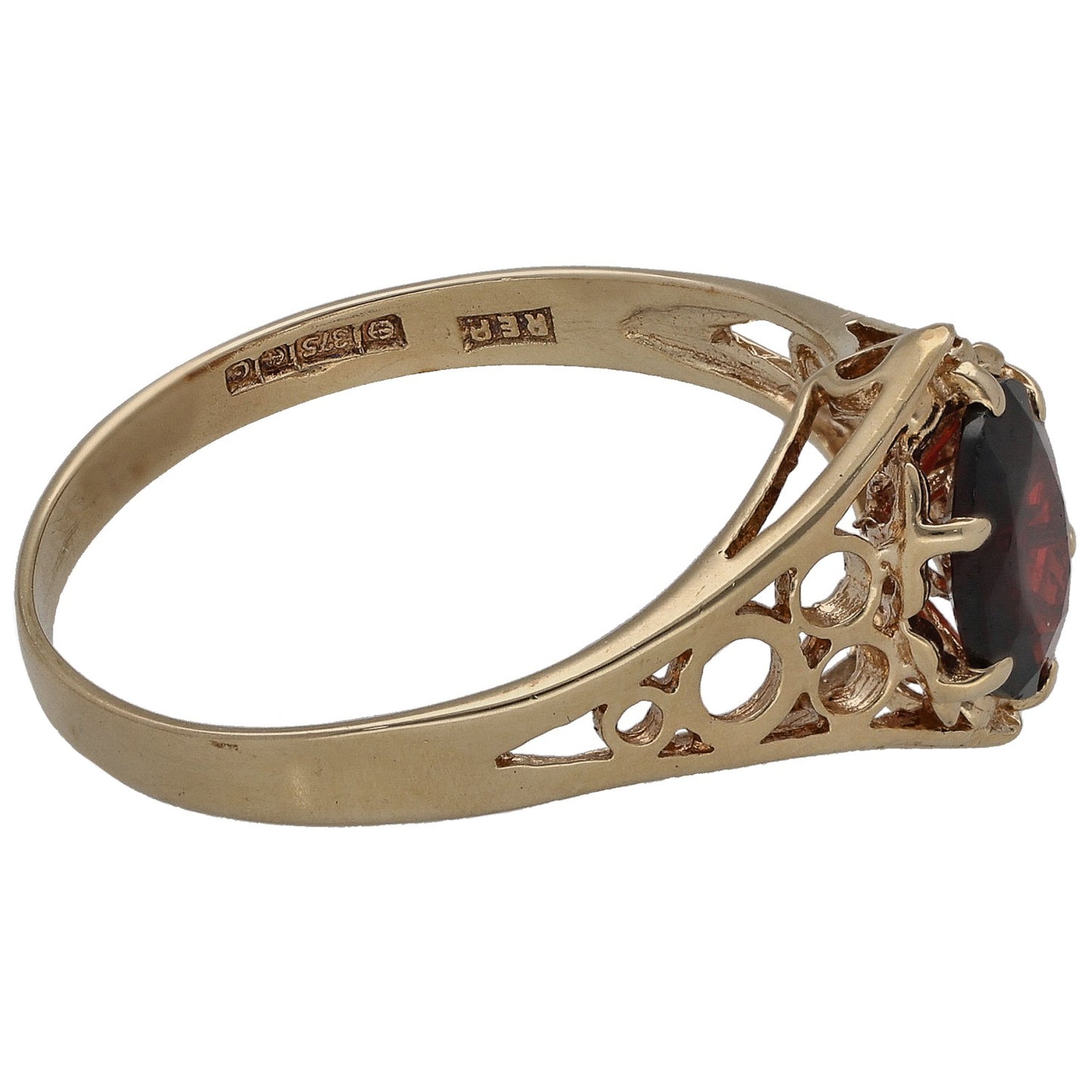 9ct gold ring side view with garnet set in ornate openwork bezel