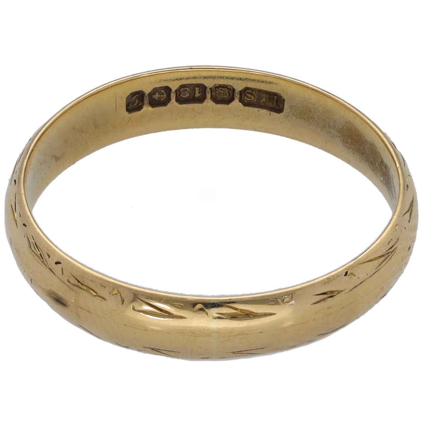Gold wedding ring inside view showing engraved inscription across band