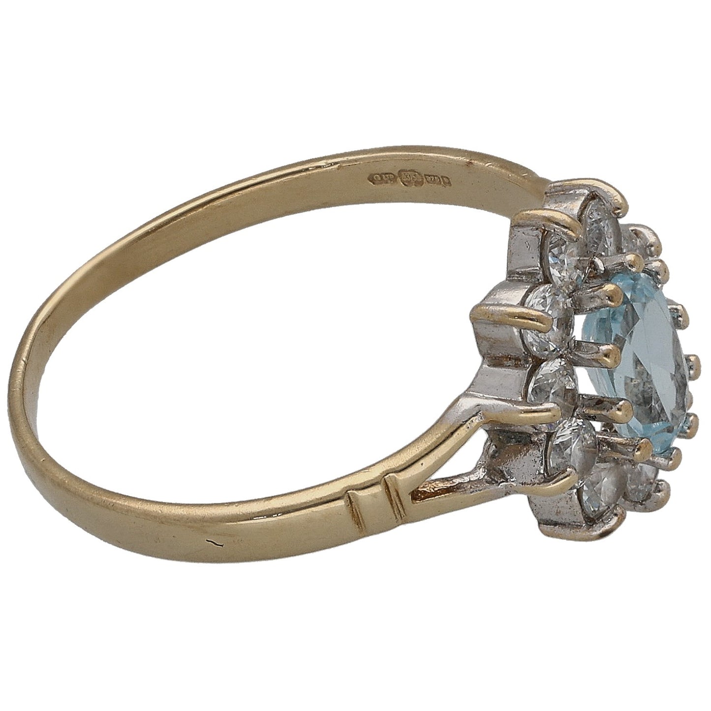 Gold ring with blue oval topaz and clear CZ stones, side profile with band