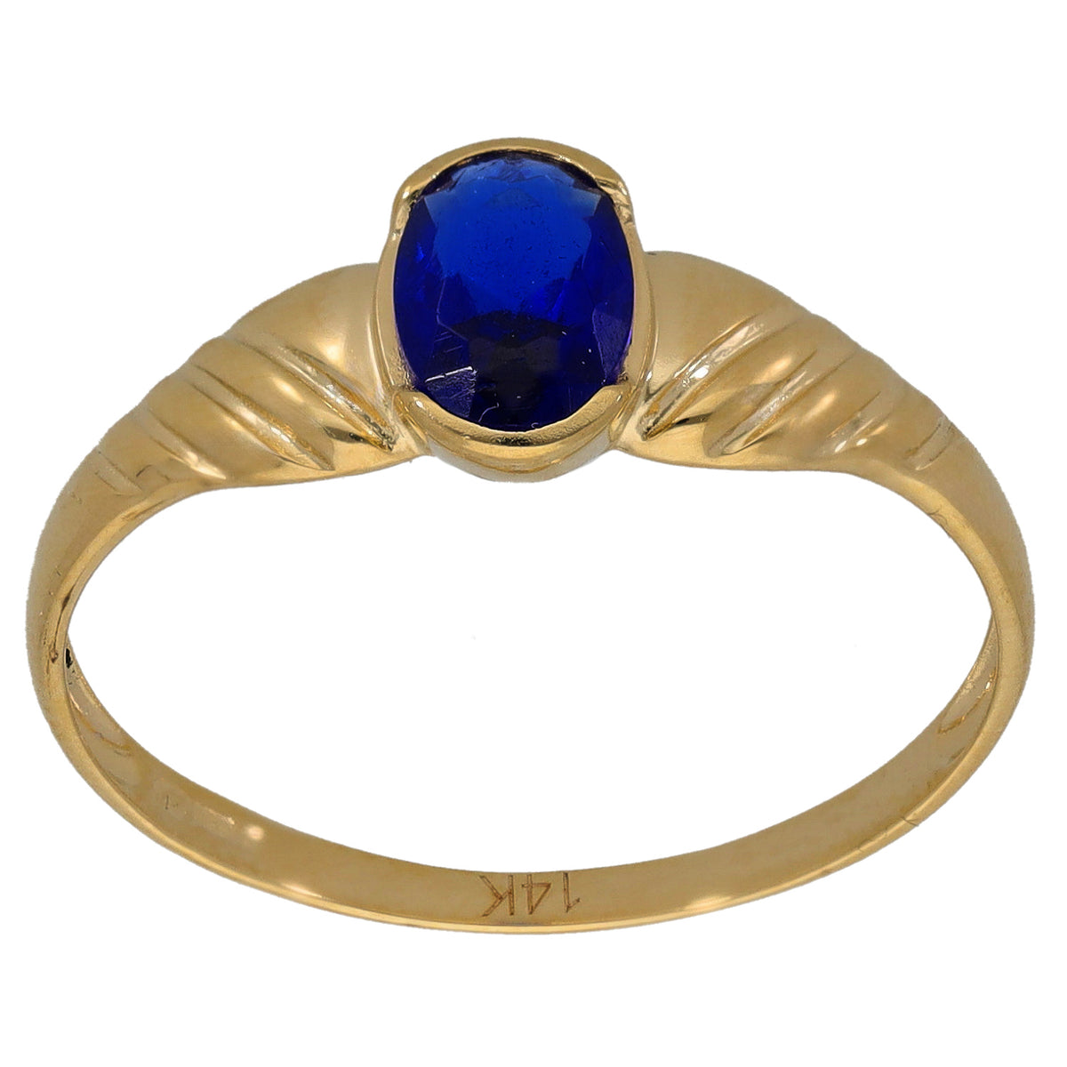 Gold-tone ring with raised blue oval gemstone on slim band with engraved pattern