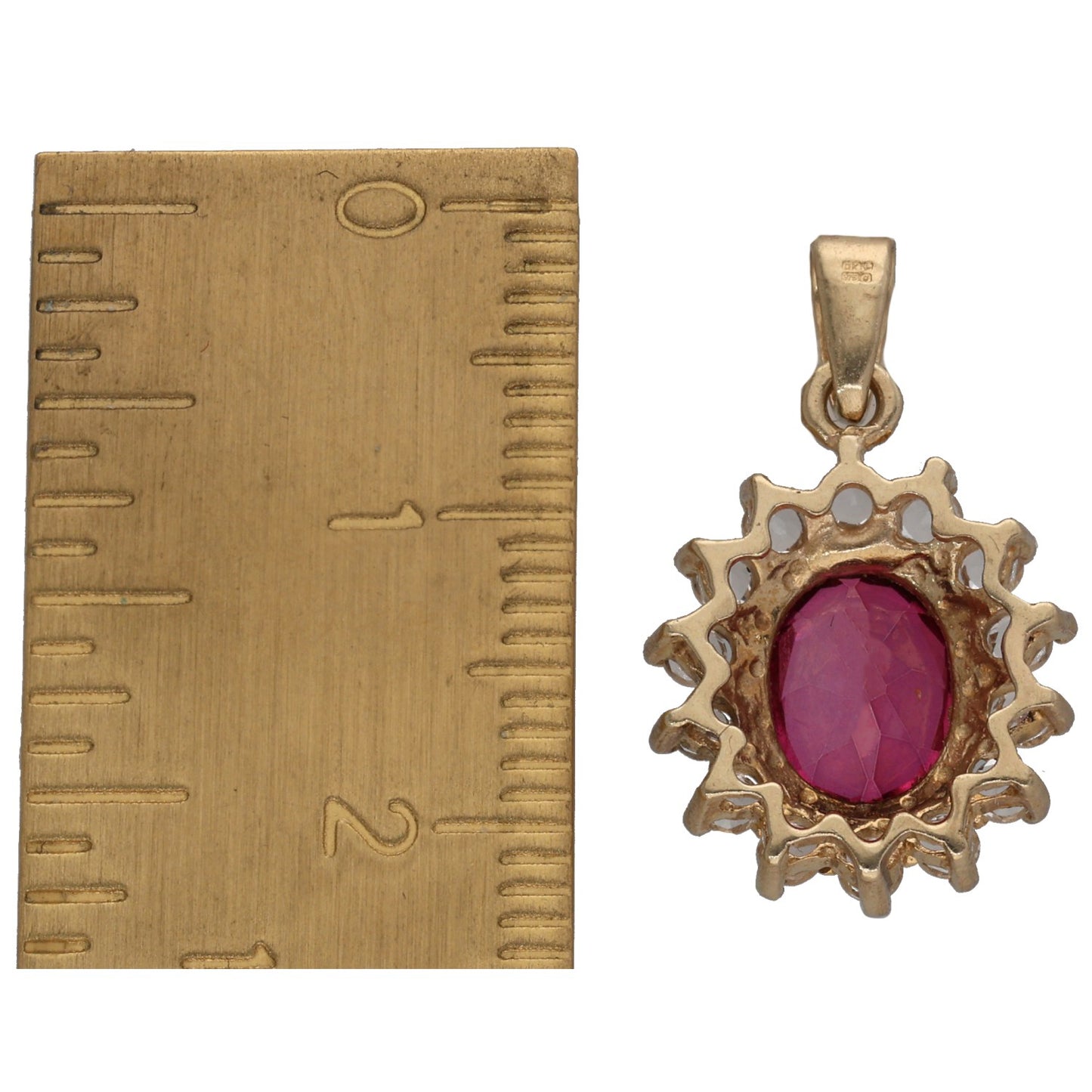 Small gold-tone oval gemstone pendant with purple center and spiky halo, on bail