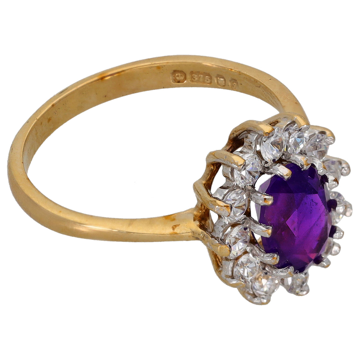 Gold amethyst halo ring with purple center stone and clear cubic zirconia accents