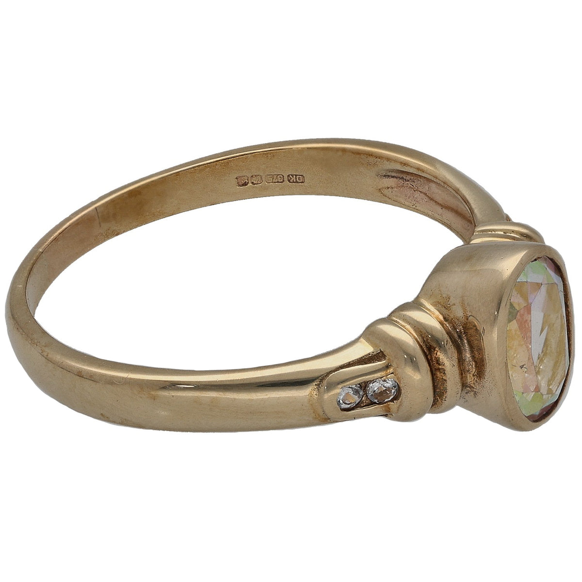 Gold-tone ring with oval iridescent stone, small side accent stones, and hallmarked band