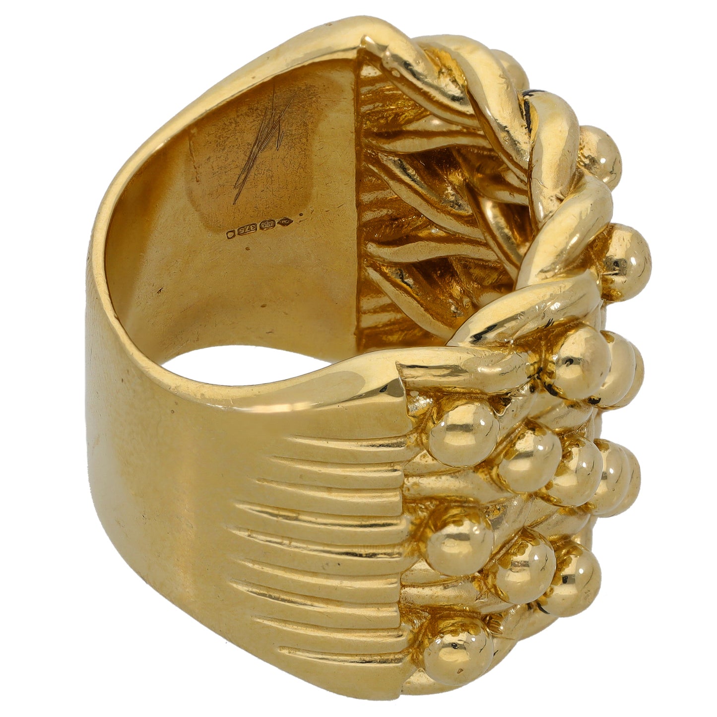 Gold keeper-style ring with raised ribbons and round bead details