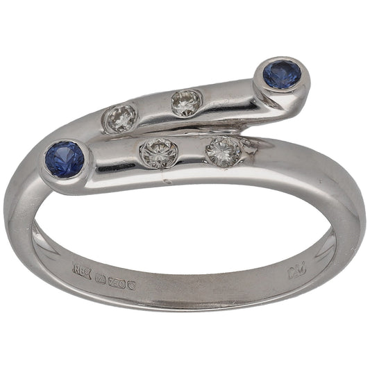White gold ring with round blue sapphires and small round diamond accents