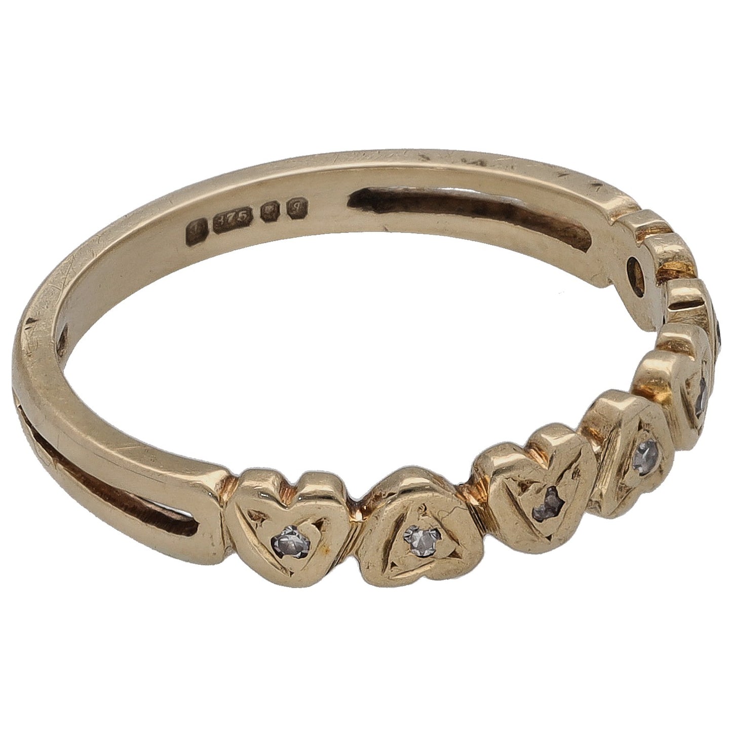 9ct gold half eternity ring side view with round diamond bezels and inner hallmark