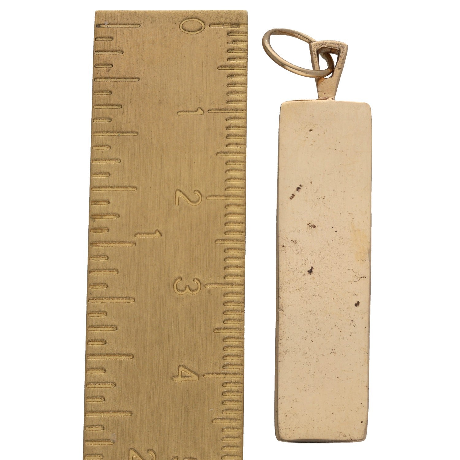 9ct gold ingot pendant bar next to ruler, plain front with bail loop
