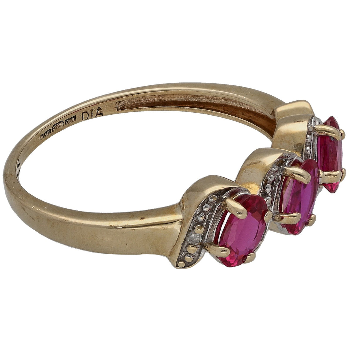 Gold ring side view with two marquise-cut red rubies and small diamond accents