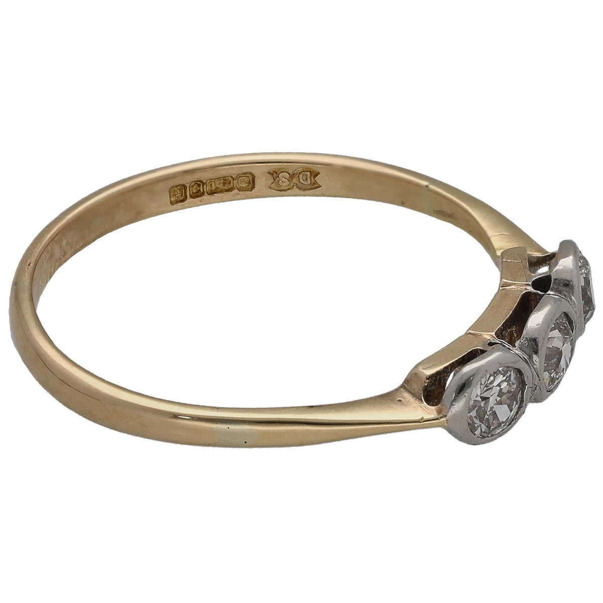 18k yellow gold three-stone ring side view with hallmarked band and round diamonds
