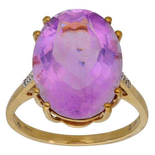 9ct gold ring with oval amethyst center stone and small round diamonds on the band