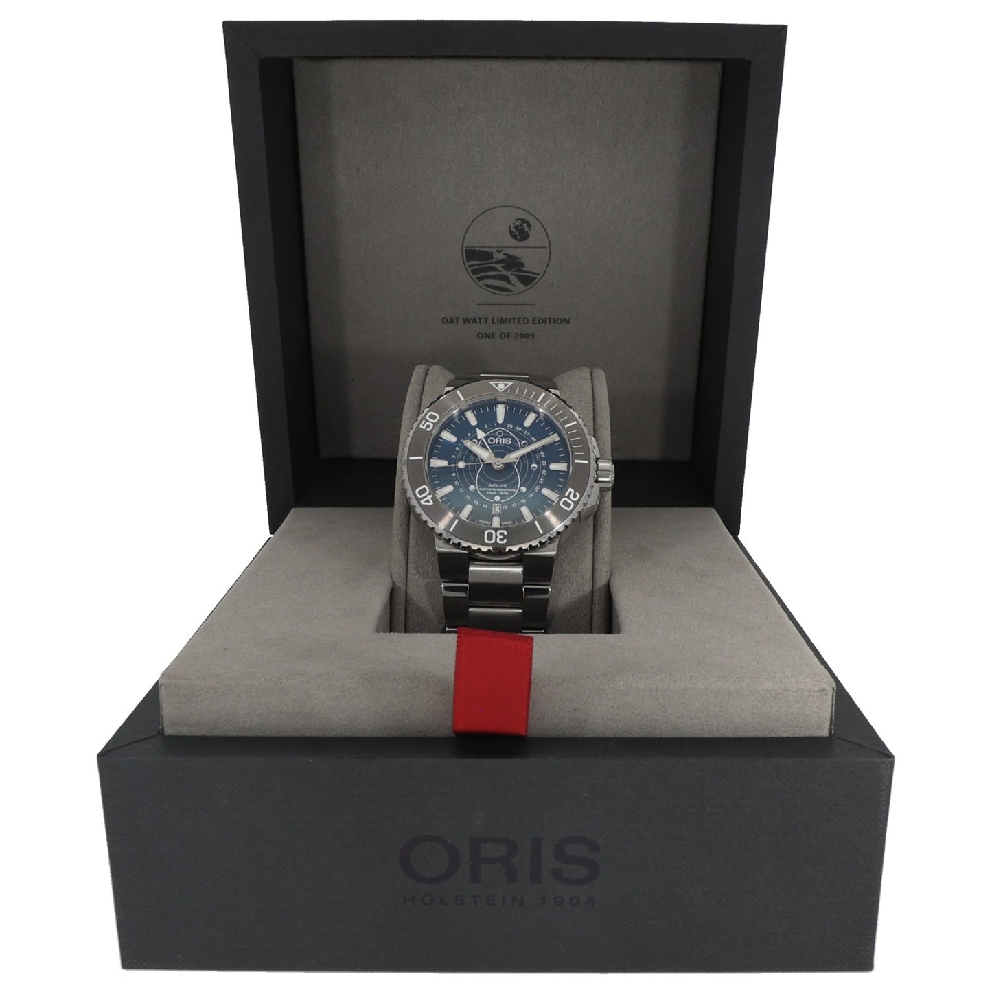 Oris Aquis 01 761 7765 4185 Stainless steel diver watch resting in presentation box with red fabric strap tag