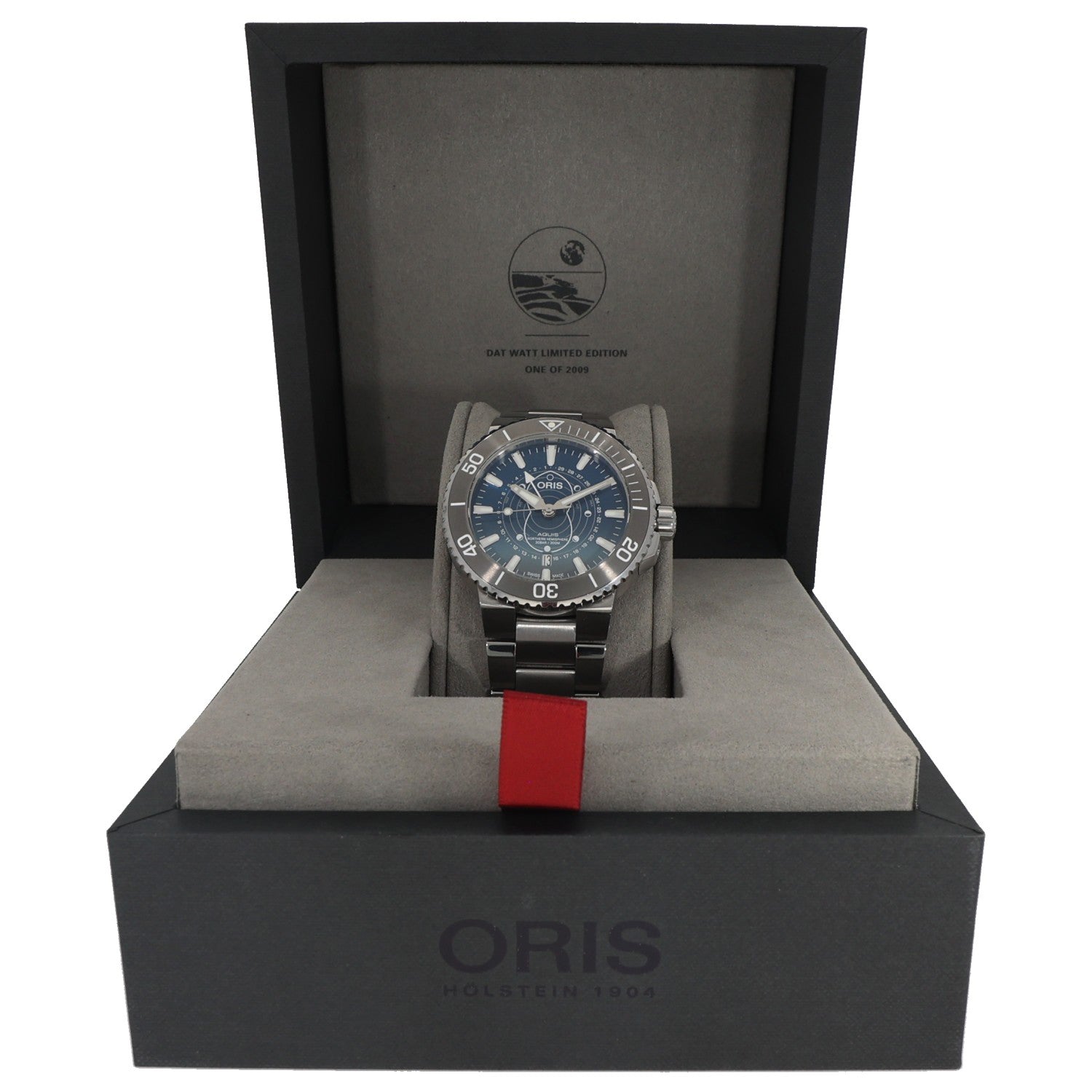 Oris Aquis 01 761 7765 4185 Stainless steel diver watch resting in presentation box with red fabric strap tag
