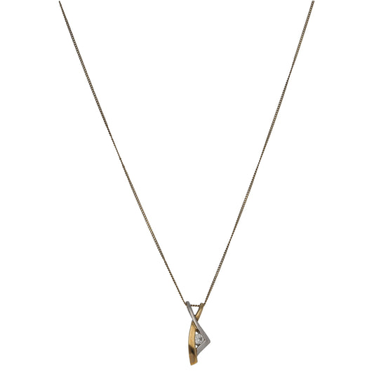 Two-tone gold CZ pendant on chain, teardrop-shaped setting with clear stone