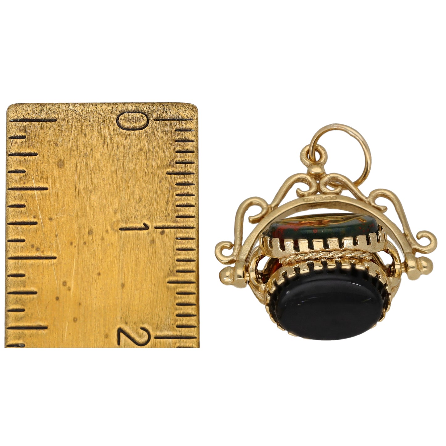 Gold fob pendant with red oval stone and dark oval stone, loop bail for chain