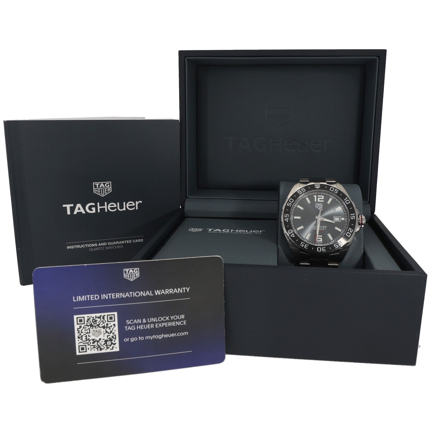 Tag Heuer F1 WAZ2011 watch in packaging with warranty card and instruction booklet