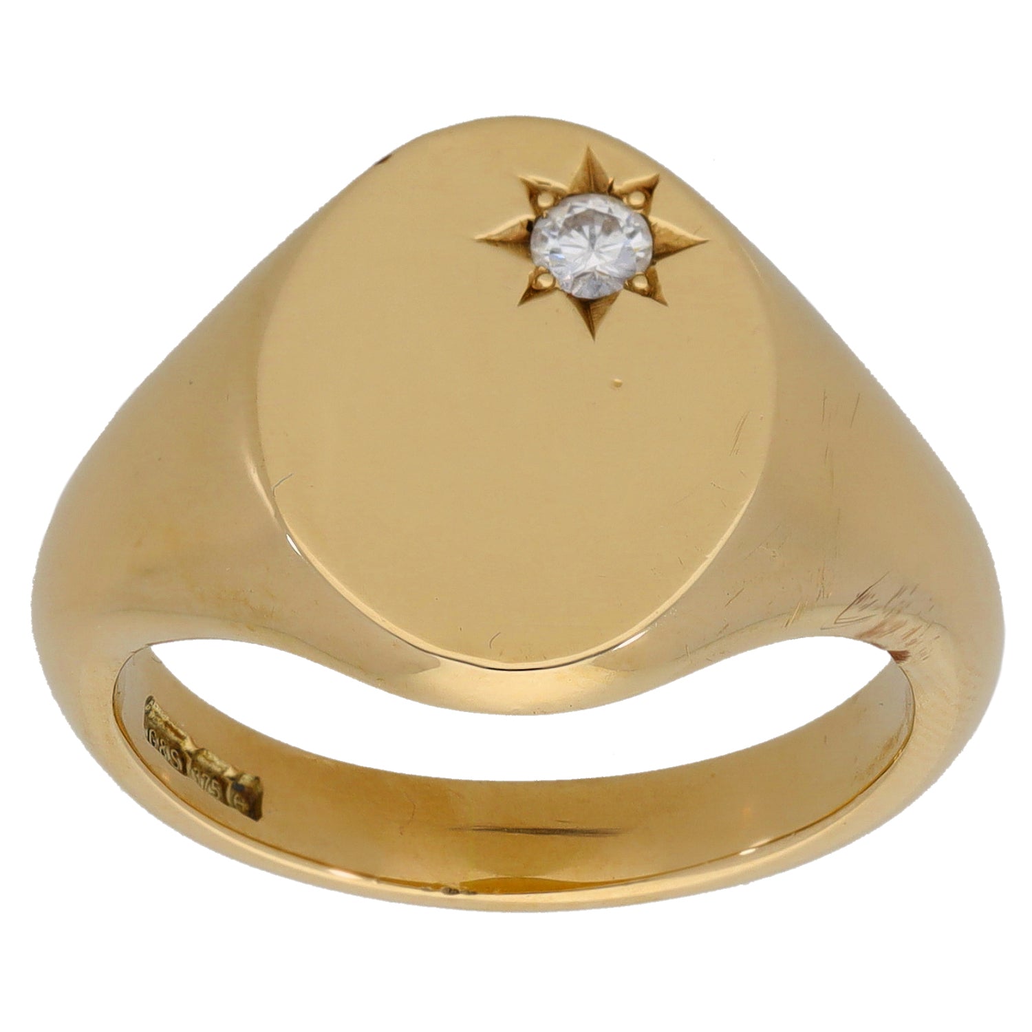 Yellow gold signet ring with round diamond in a starburst setting