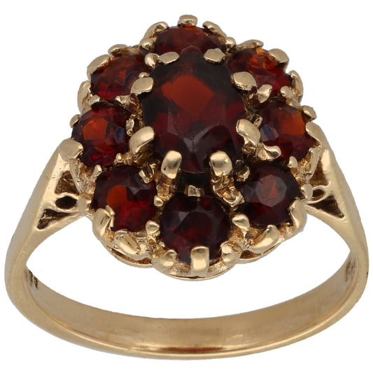 9ct gold garnet cluster cocktail ring with oval center and prong settings