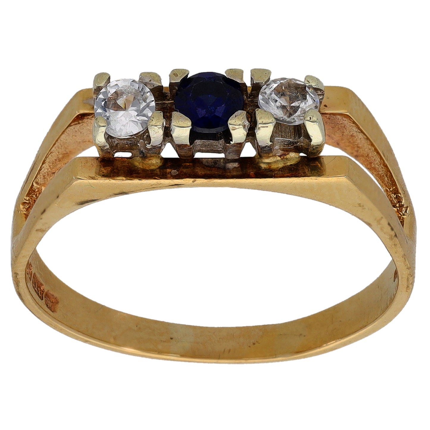 Gold-tone three-stone ring with two clear stones and a dark blue center stone